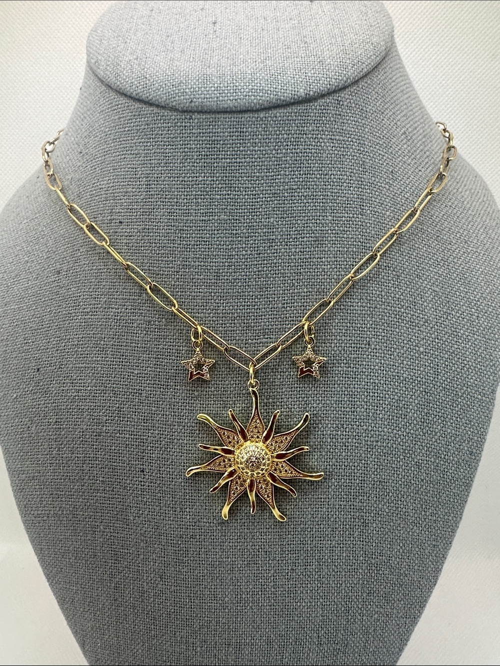Gold Sunburst Pendant Necklace with Star Charms